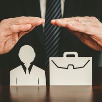 Insurer protecting an employee and a briefcase with his hands